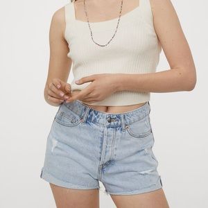 High waisted distressed light blue denim shorts
